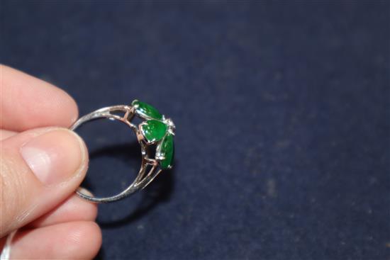 A modern 18k white metal, jadeite and diamond set flowerhead cluster ring, size P.